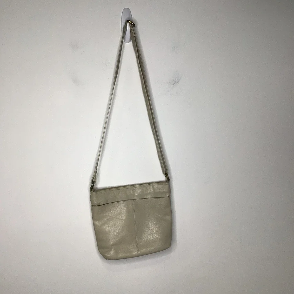 Born tan‎ leather crossbody bag